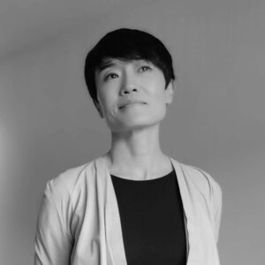 Headshot of Jin Hu who is a Centralized Screening Agent at ASG